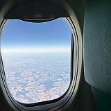 In het vliegtuig naar huis